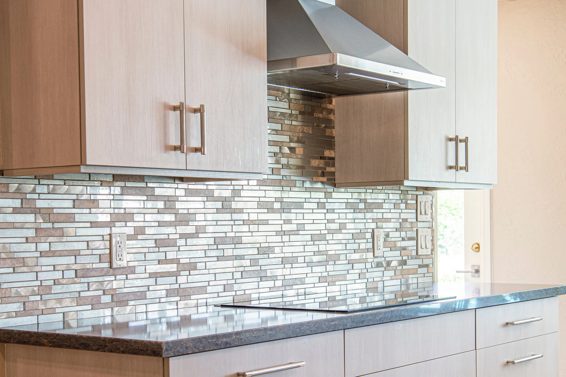 Refined kitchen with marble backsplash